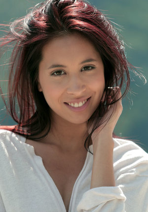 1 dark haired female tortures another during lezdom play in concrete cellar