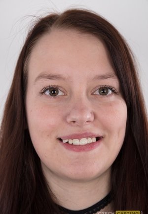 18 year old girl Katie Lewis stands naked after undressing in her bedroom