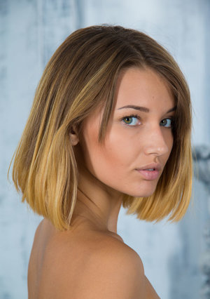 1 dark haired female tortures another during lezdom play in concrete cellar