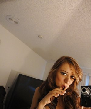 18 year old girl Megan Rain removes her sandals and then clothes to pose naked