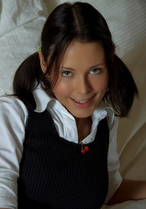 18 year old girl Agnes uncovers her perky tits as she gets completely naked