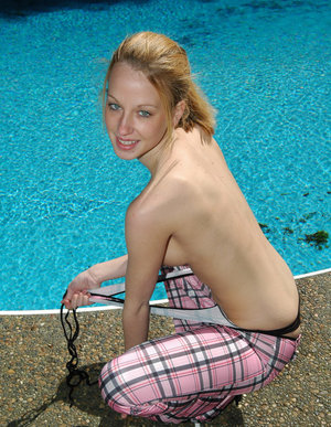 18 year old female Chloe Dash undressing on yoga mat on lawn