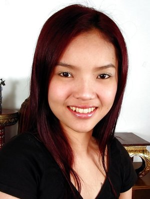 18 year old girl Megan Rain removes her sandals and then clothes to pose naked