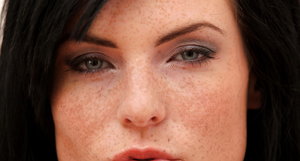 18 year old girl Katie Lewis stands naked after undressing in her bedroom